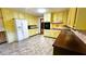Well-lit kitchen featuring ample cabinet space, tiled countertops, and modern appliances at 1110 Blackwell Rd, Marietta, GA 30066