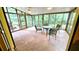 Enclosed sunroom with lots of windows letting in natural light and views of the beautiful, green exterior at 1110 Blackwell Rd, Marietta, GA 30066