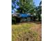 Exterior view of home showing siding and roof with blue tarp at 2700 Snapfinger Rd, Decatur, GA 30034