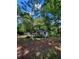 View of the home's exterior, showing the yard and surrounding mature trees at 2700 Snapfinger Rd, Decatur, GA 30034