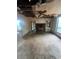 Living room featuring a fireplace, damaged ceiling, and dated carpet at 2700 Snapfinger Rd, Decatur, GA 30034