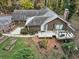 Aerial view of home nestled among a canopy of mature trees and landscaping at 2775 Hogan Rd, Atlanta, GA 30344