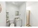 Modest bathroom featuring a shower stall, toilet, and sink at 2775 Hogan Rd, Atlanta, GA 30344