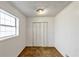 Simple bedroom featuring a closet, carpeted floors, and plenty of natural light at 2775 Hogan Rd, Atlanta, GA 30344