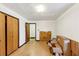 Bedroom with wood floors, boxes, and closet space at 2775 Hogan Rd, Atlanta, GA 30344