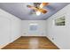 Cozy bedroom with a wood-look floor, a window, and a fan at 2775 Hogan Rd, Atlanta, GA 30344