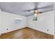 A clean, bright bedroom with wood-look floors and paneled walls at 2775 Hogan Rd, Atlanta, GA 30344