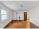 Cozy bedroom with hardwood floors, natural light, and an open doorway at 2775 Hogan Rd, Atlanta, GA 30344