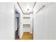 Hallway with open doorway, shelves and hooks for hanging at 2775 Hogan Rd, Atlanta, GA 30344