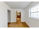 Hallway featuring closet space, neutral walls, and natural lighting at 2775 Hogan Rd, Atlanta, GA 30344