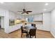 Spacious kitchen with white cabinets, stainless steel appliances, and an adjacent dining area at 2775 Hogan Rd, Atlanta, GA 30344