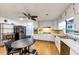 Open kitchen with dining area featuring stainless steel appliances and white cabinetry at 2775 Hogan Rd, Atlanta, GA 30344
