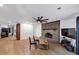 Bright living room featuring a brick fireplace, wood floors, and sliding glass doors to the outside at 2775 Hogan Rd, Atlanta, GA 30344