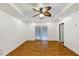 Bright room with wood floors, recessed lighting, ceiling fan, and sliding glass doors leading outside at 2775 Hogan Rd, Atlanta, GA 30344