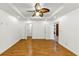 Bright room with wood floors, recessed lighting, ceiling fan, and doors leading to other rooms at 2775 Hogan Rd, Atlanta, GA 30344