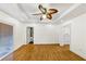 Bright room with wood floors, recessed lighting, ceiling fan, and sliding glass doors leading outside at 2775 Hogan Rd, Atlanta, GA 30344