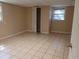Bedroom with neutral walls, tiled floor, and a closet, offering a blank canvas at 3026 Hidden Forest Dr, Snellville, GA 30078