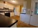 Functional kitchen featuring white cabinets and tiled backsplash at 3026 Hidden Forest Dr, Snellville, GA 30078