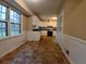 Bright kitchen featuring white cabinets and black countertops, ready for your culinary creations at 3026 Hidden Forest Dr, Snellville, GA 30078