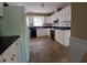 Charming kitchen featuring white cabinetry and black appliances at 3026 Hidden Forest Dr, Snellville, GA 30078