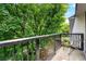 Balcony showcasing a table and lush greenery at 3304 Pine Heights Ne Dr, Atlanta, GA 30324