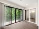 Private balcony with sliding glass doors and wooded views at 3304 Pine Heights Ne Dr, Atlanta, GA 30324