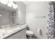 Bathroom features updated fixtures, a shower with gray tile, and a modern sink at 3304 Pine Heights Ne Dr, Atlanta, GA 30324