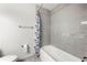 Bathroom showcasing a bathtub with tiled wall and a shower curtain at 3304 Pine Heights Ne Dr, Atlanta, GA 30324