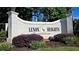 Lenox Heights Condominiums sign with manicured landscaping in a desirable location at 3304 Pine Heights Ne Dr, Atlanta, GA 30324