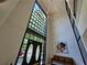 Bright and airy foyer featuring tall ceilings, modern chandelier lighting, and contemporary art at 3304 Pine Heights Ne Dr, Atlanta, GA 30324