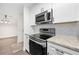 Modern kitchen features stainless steel appliances, granite countertops, and white subway tile backsplash at 3304 Pine Heights Ne Dr, Atlanta, GA 30324