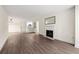 Open-concept living space connecting dining area, kitchen, fireplace and entry at 3304 Pine Heights Ne Dr, Atlanta, GA 30324