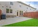 Private backyard with artificial turf, a concrete patio, and a wooden fence, providing a low-maintenance outdoor space at 2243 Knoxhill Se Vw, Smyrna, GA 30082