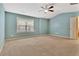 Spacious carpeted bedroom with a ceiling fan and window at 2243 Knoxhill Se Vw, Smyrna, GA 30082
