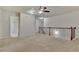 Spacious upstairs hallway with wood railing and neutral carpet at 2243 Knoxhill Se Vw, Smyrna, GA 30082