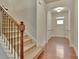 Hallway features hardwood floors, staircase, and entry to other rooms at 2243 Knoxhill Se Vw, Smyrna, GA 30082