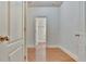 Bright hallway with hardwood floors and view of bathroom at 2243 Knoxhill Se Vw, Smyrna, GA 30082