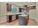 Well-equipped kitchen featuring stainless steel appliances, granite countertops, and dark brown cabinets at 2243 Knoxhill Se Vw, Smyrna, GA 30082
