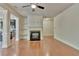 Bright living room featuring a fireplace, hardwood floors, and an open floor plan at 2243 Knoxhill Se Vw, Smyrna, GA 30082