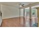 Open-concept living area with hardwood floors, large windows, and classic columns at 2243 Knoxhill Se Vw, Smyrna, GA 30082