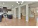 Inviting open-concept living space with dark brown kitchen cabinets, hardwood floors, and a fireplace at 2243 Knoxhill Se Vw, Smyrna, GA 30082