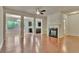 Spacious living room with hardwood floors, fireplace, and abundant natural light at 2243 Knoxhill Se Vw, Smyrna, GA 30082