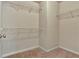 Walk-in closet with neutral carpet and wire shelving for optimal storage at 2243 Knoxhill Se Vw, Smyrna, GA 30082