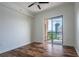Bedroom features hardwood floors, neutral walls, and a sliding glass door to the balcony at 3445 Stratford Rd # 1501, Atlanta, GA 30326