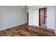Spacious bedroom with hardwood floors and a walk-in closet with custom shelving at 3445 Stratford Rd # 1501, Atlanta, GA 30326