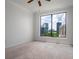 Bedroom with carpet and a large window that offers a stunning view of the city skyline at 3445 Stratford Rd # 1501, Atlanta, GA 30326