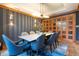 Elegant dining room with modern lighting and a stunning wine cellar at 3445 Stratford Rd # 1501, Atlanta, GA 30326