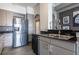 Modern kitchen featuring stainless steel appliances and black countertops with mosaic backsplash at 3445 Stratford Rd # 1501, Atlanta, GA 30326