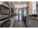 Contemporary kitchen boasts stainless steel appliances, granite countertops, and ample storage at 3445 Stratford Rd # 1501, Atlanta, GA 30326