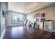 Bright living room with cityscape views, hardwood floors, and artistic modern wallpaper at 3445 Stratford Rd # 1501, Atlanta, GA 30326